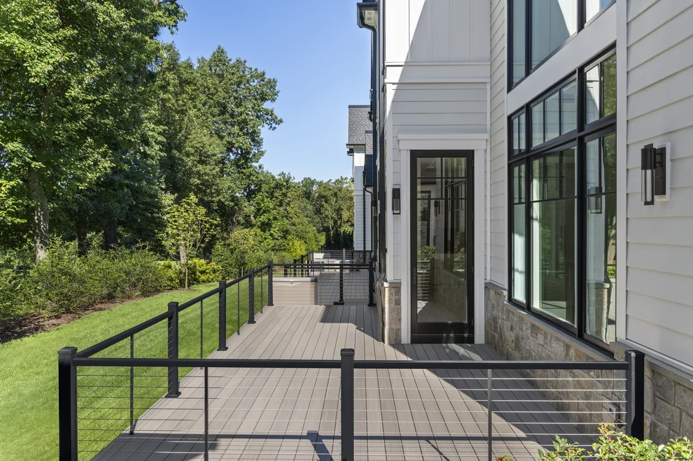 Composite deck designed to complement the architecture and siding of a Twin Cities home